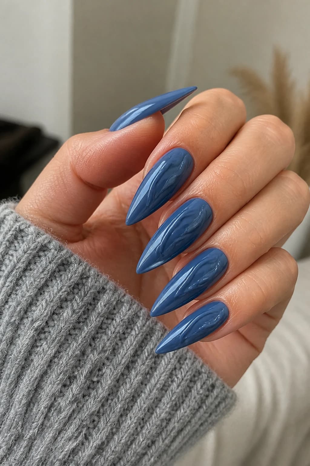 Long stiletto nails in blue with a 3D design and a glossy finish, fall nail design