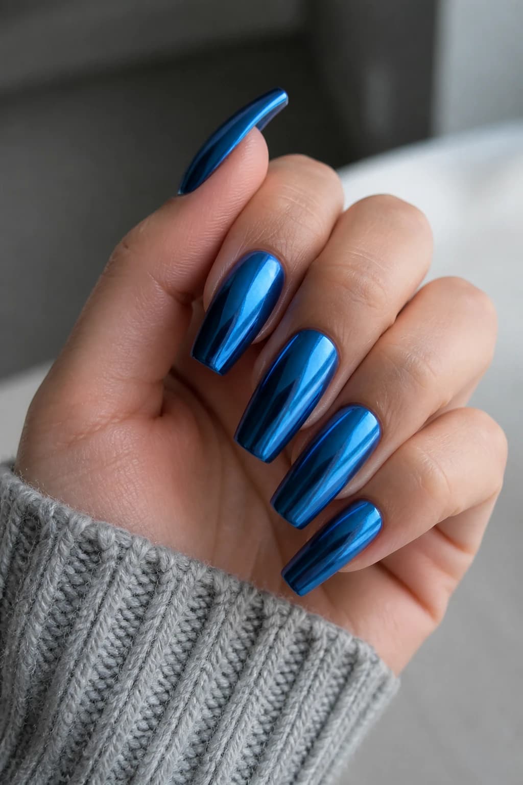 Long coffin nails in blue with a chrome finish, fall nail design