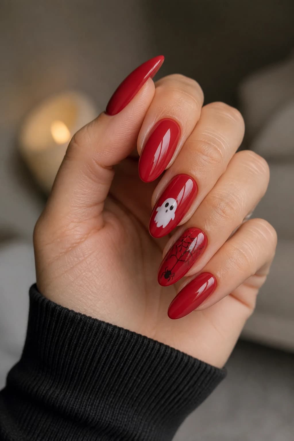 Long oval nails in red with a glossy finish, Halloween nail design
