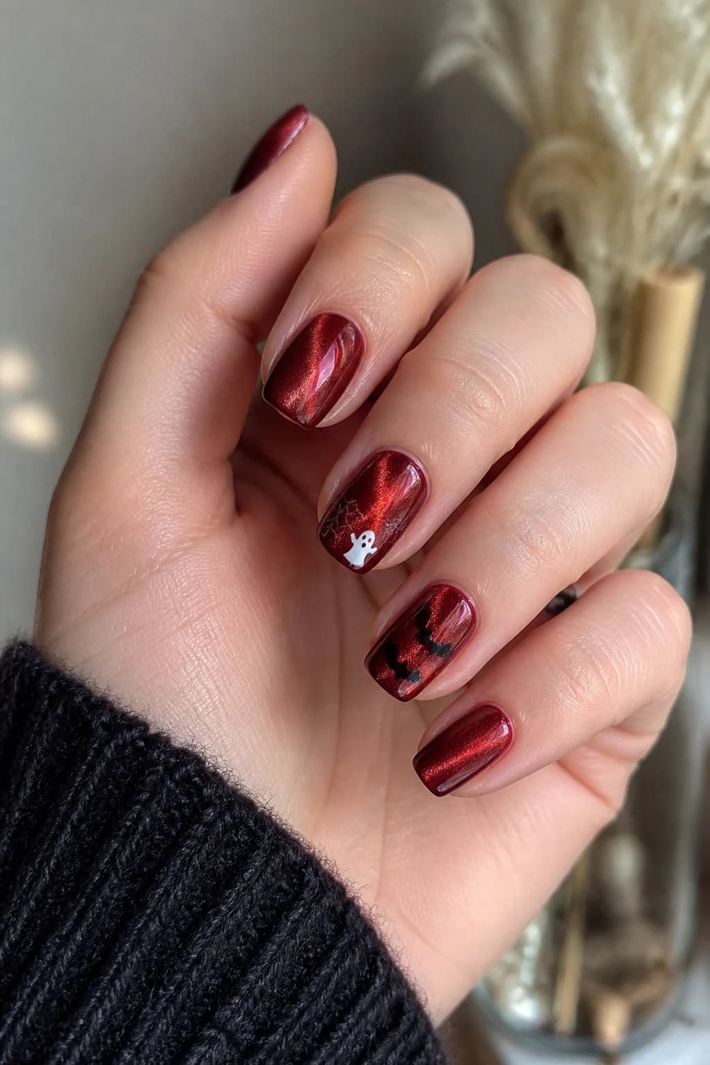 Short coffin nails in red with a cat eye finish, Halloween nail design