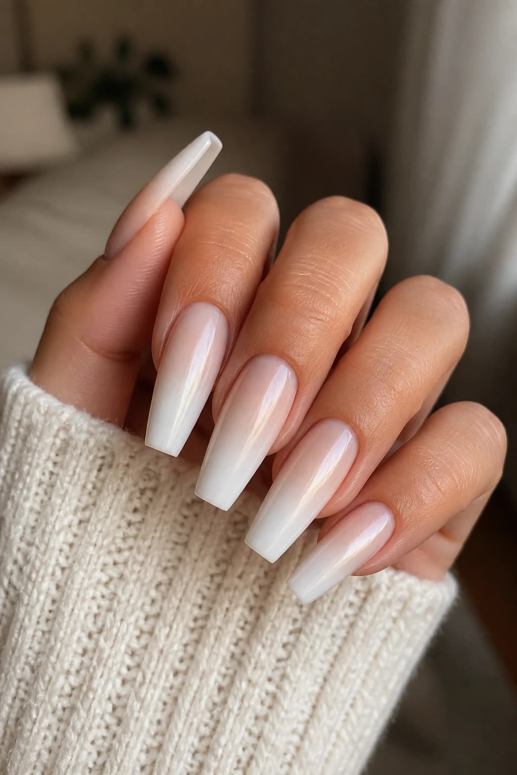 Long coffin nails in white and cream with an ombré design and a chrome finish, fall nail design