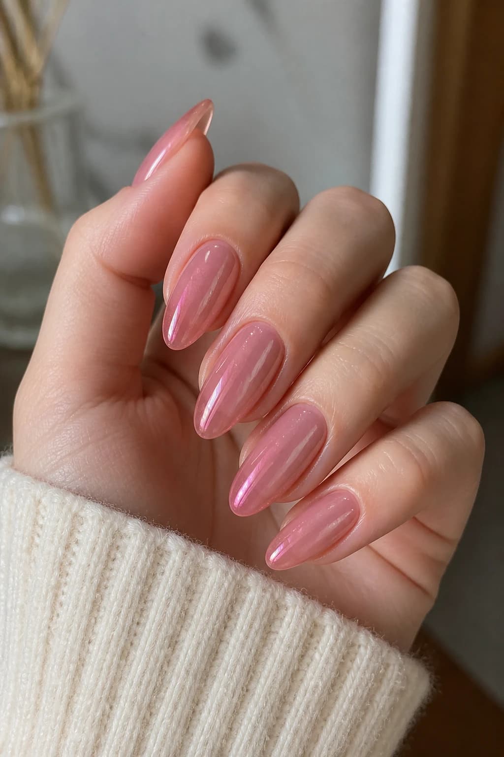 Long almond nails in pink with a jelly design and a cat eye finish, fall nail design
