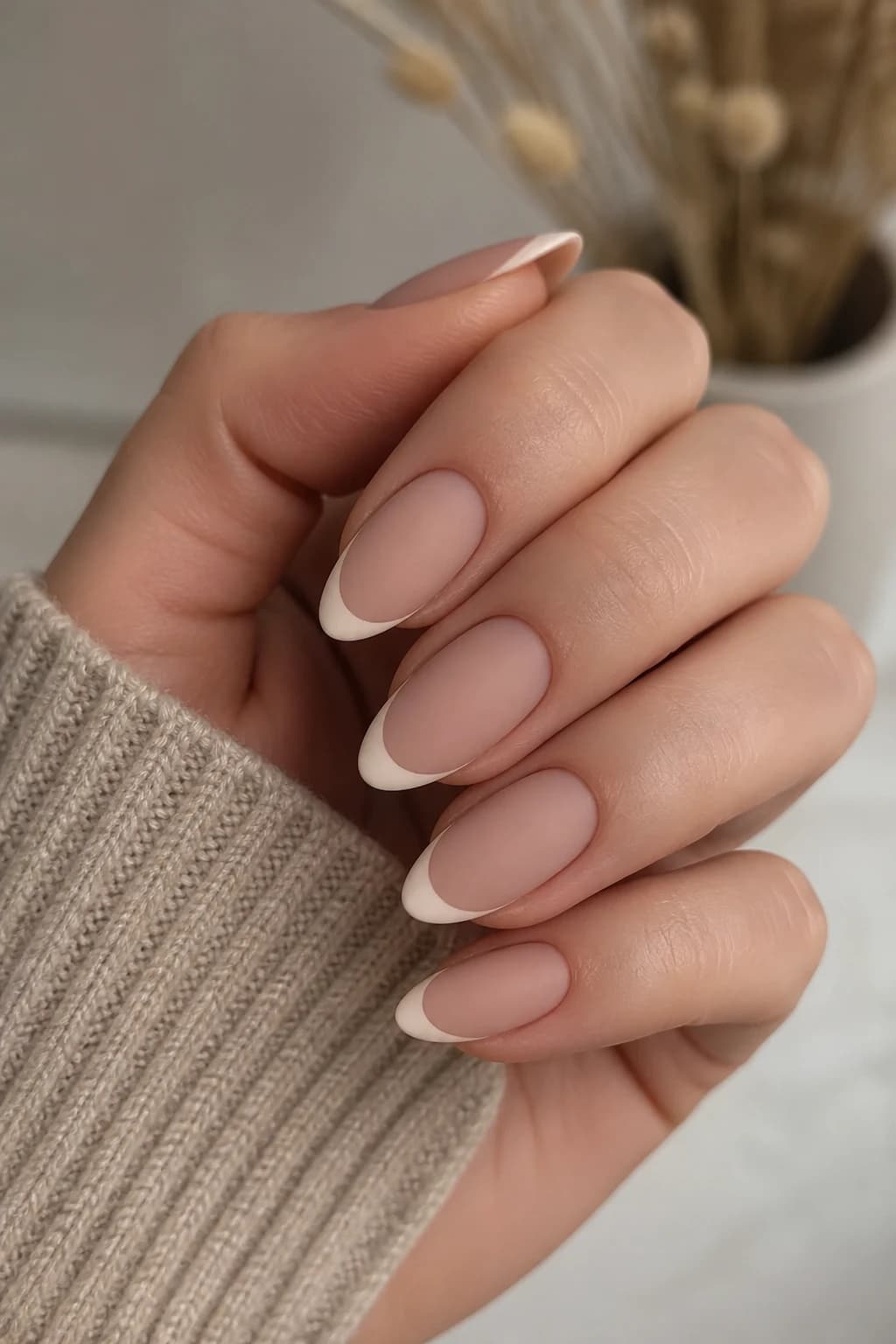 Medium almond nails in nude with a French tip design and a matte finish, fall nail design