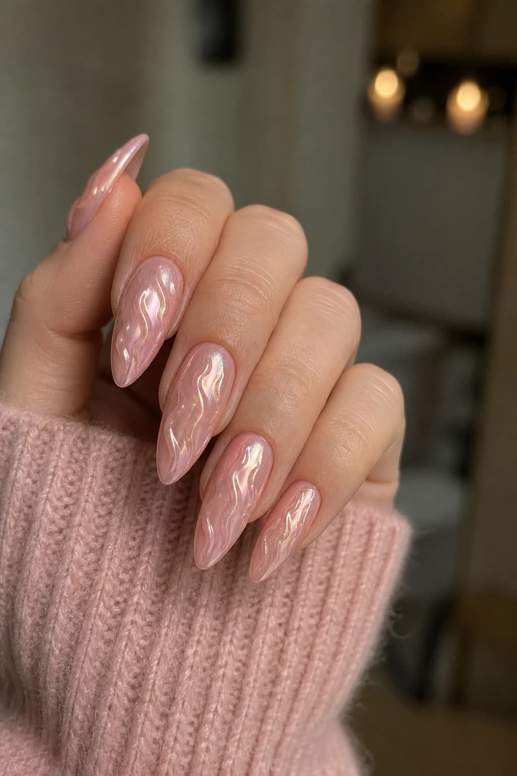 Long almond nails in pink with a 3D design and a chrome finish, fall nail design