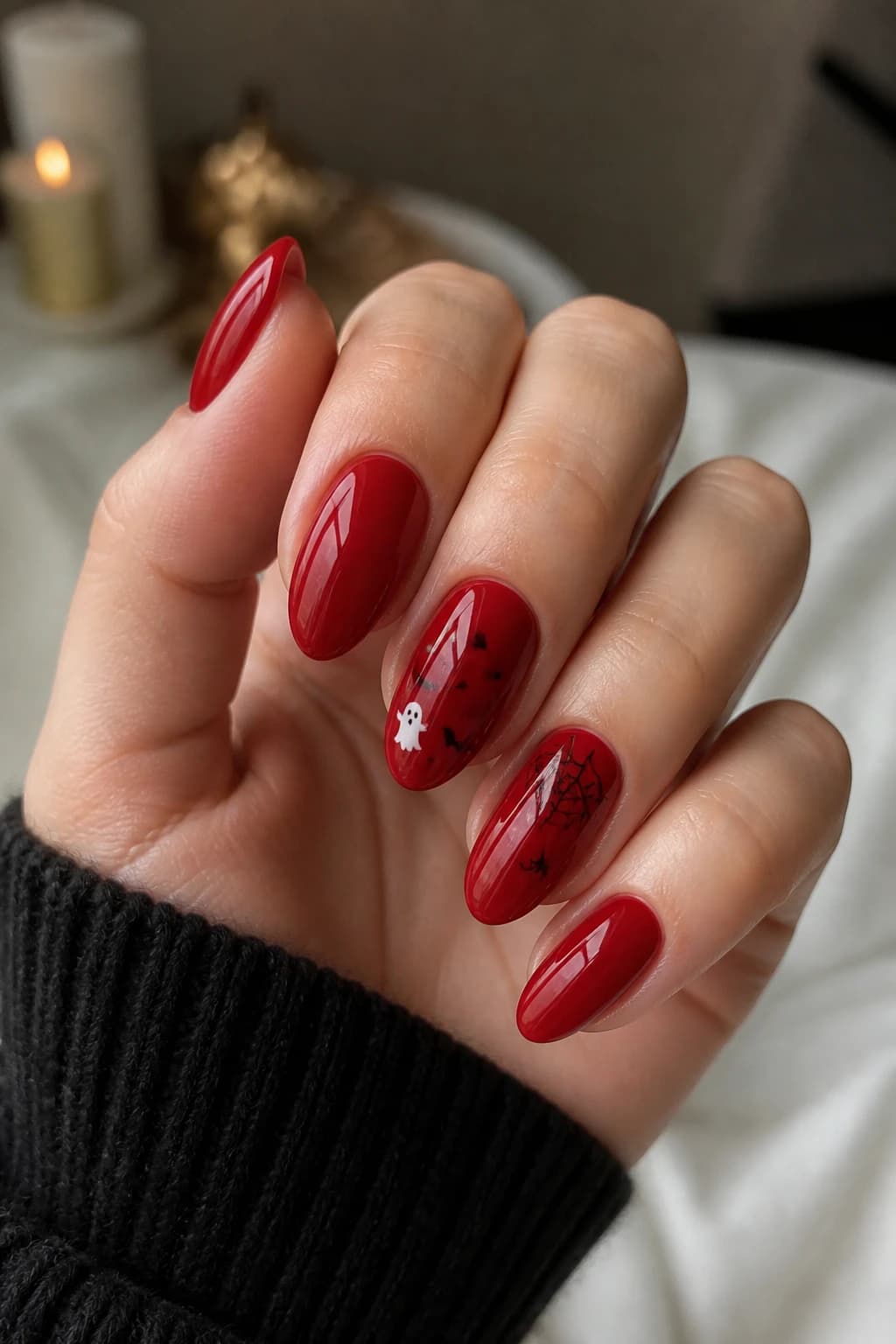 Medium oval nails in red with a glossy finish, Halloween nail design