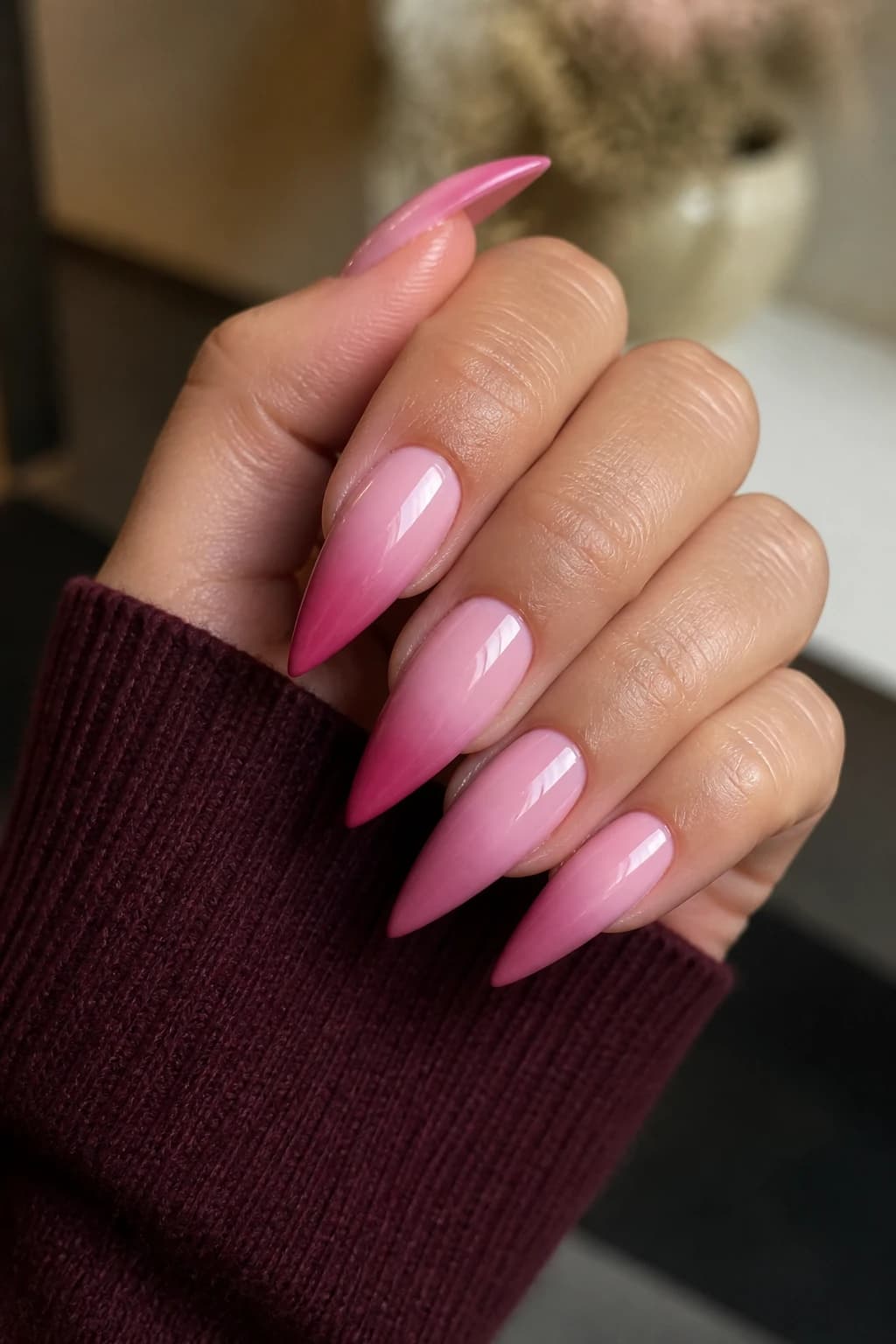 Long stiletto nails in pink with an ombré design and a glossy finish, fall nail design