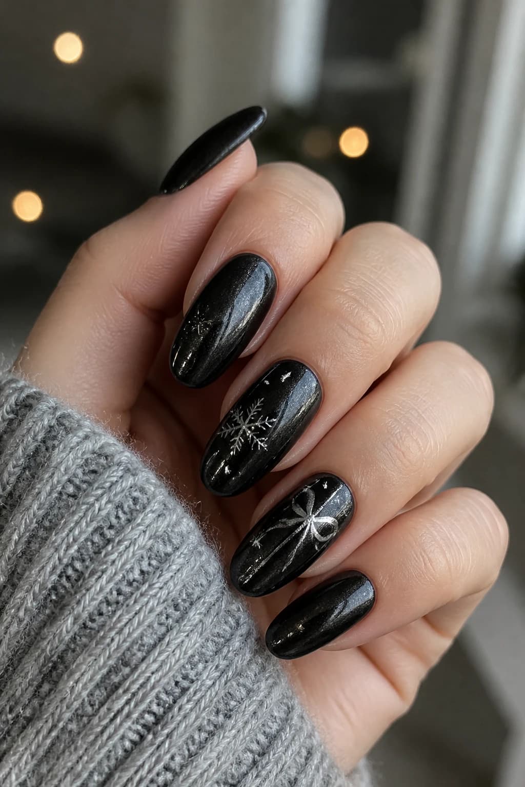 Long round nails in black with a chrome finish, Christmas nail design