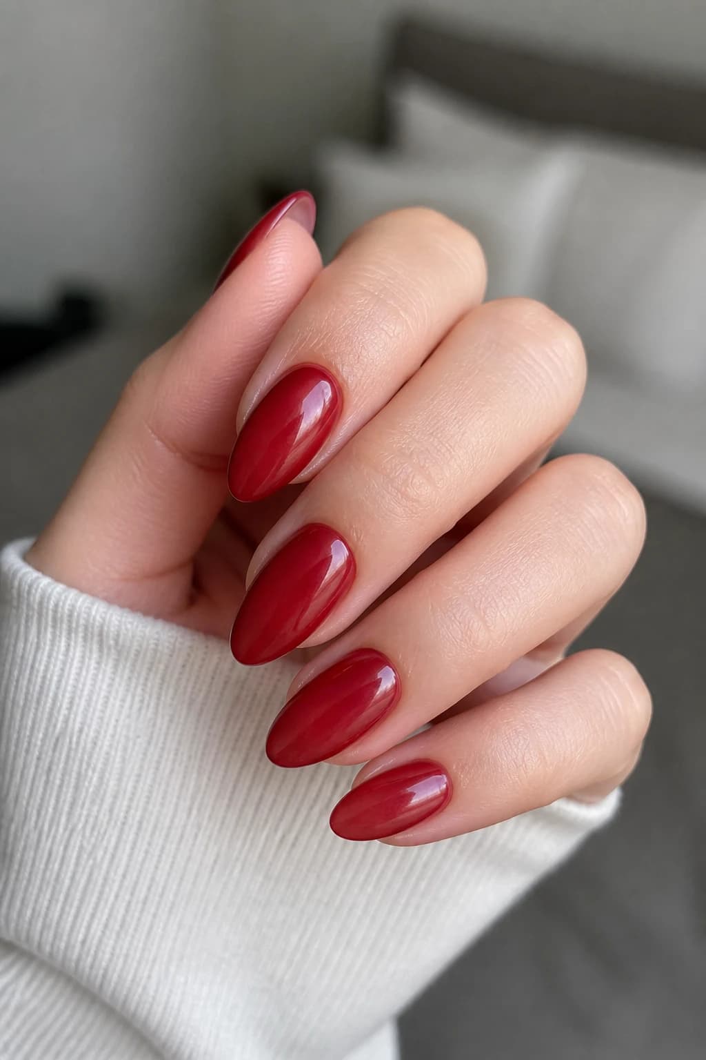 Long almond nails in red with a jelly design and a matte finish