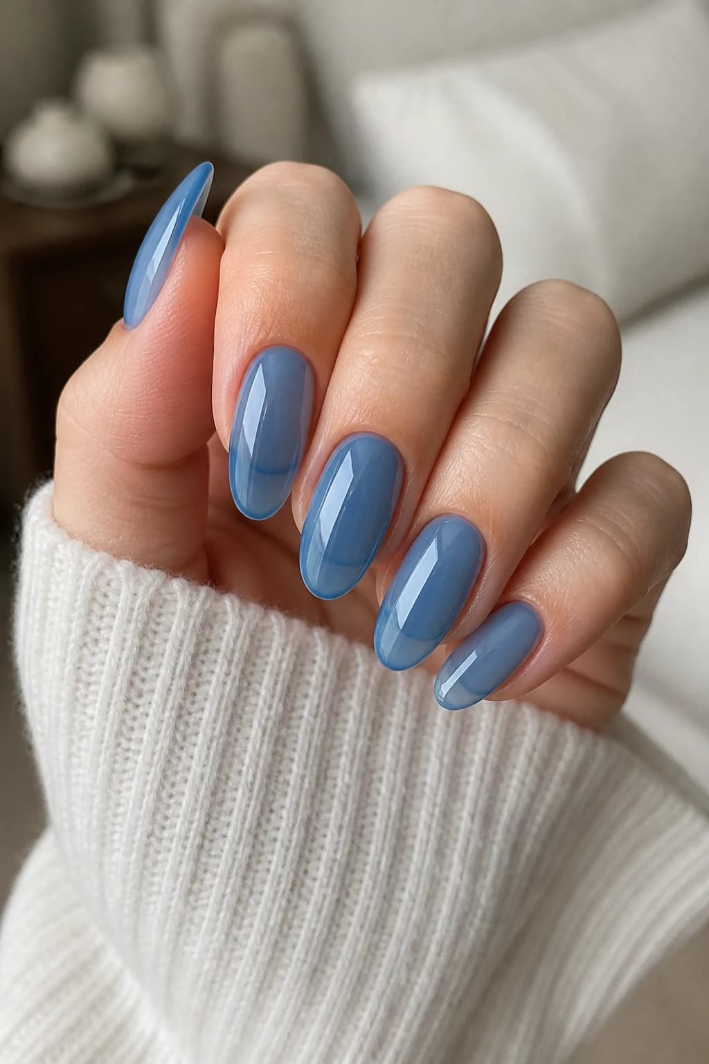 Long round nails in blue with a jelly design and a glossy finish