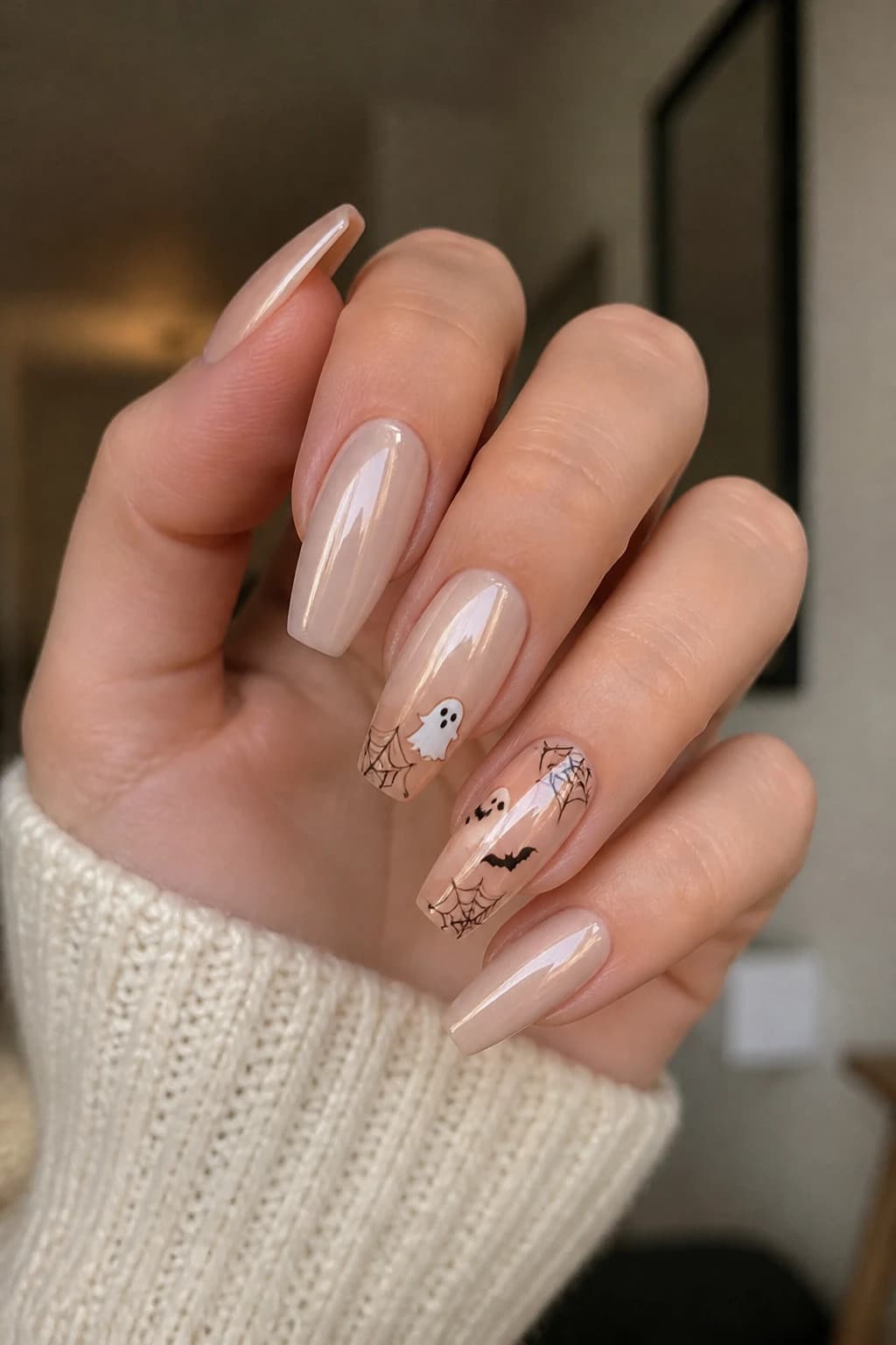 Medium coffin nails in nude with a chrome finish, Halloween nail design