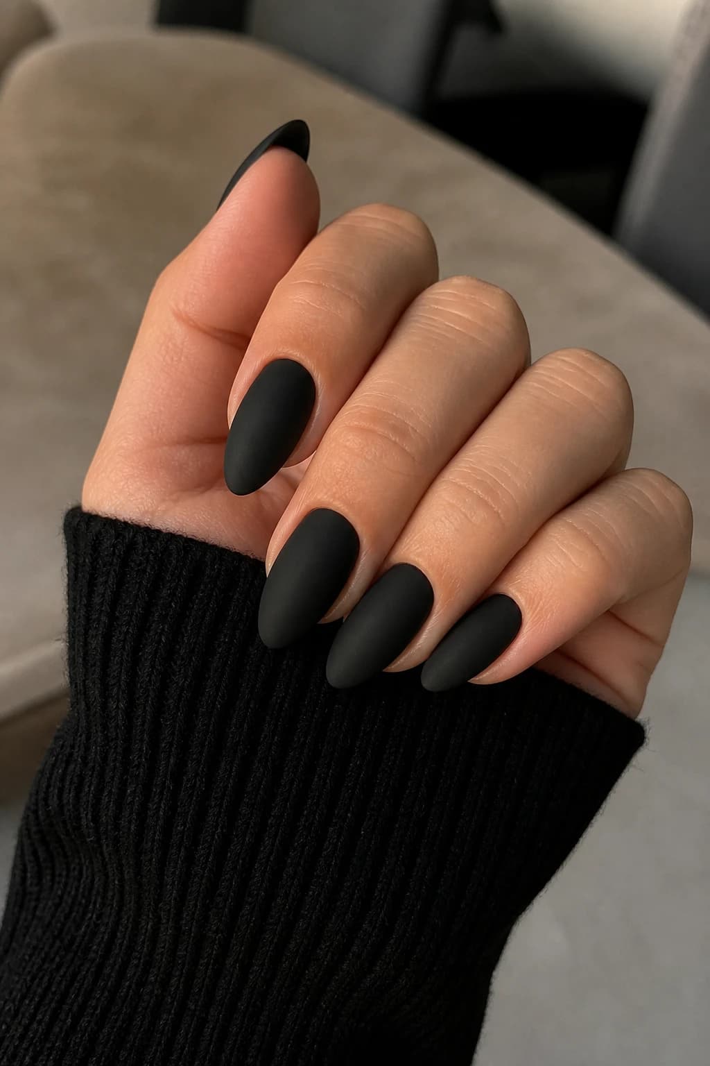 Long almond nails in black with a matte finish, fall nail design