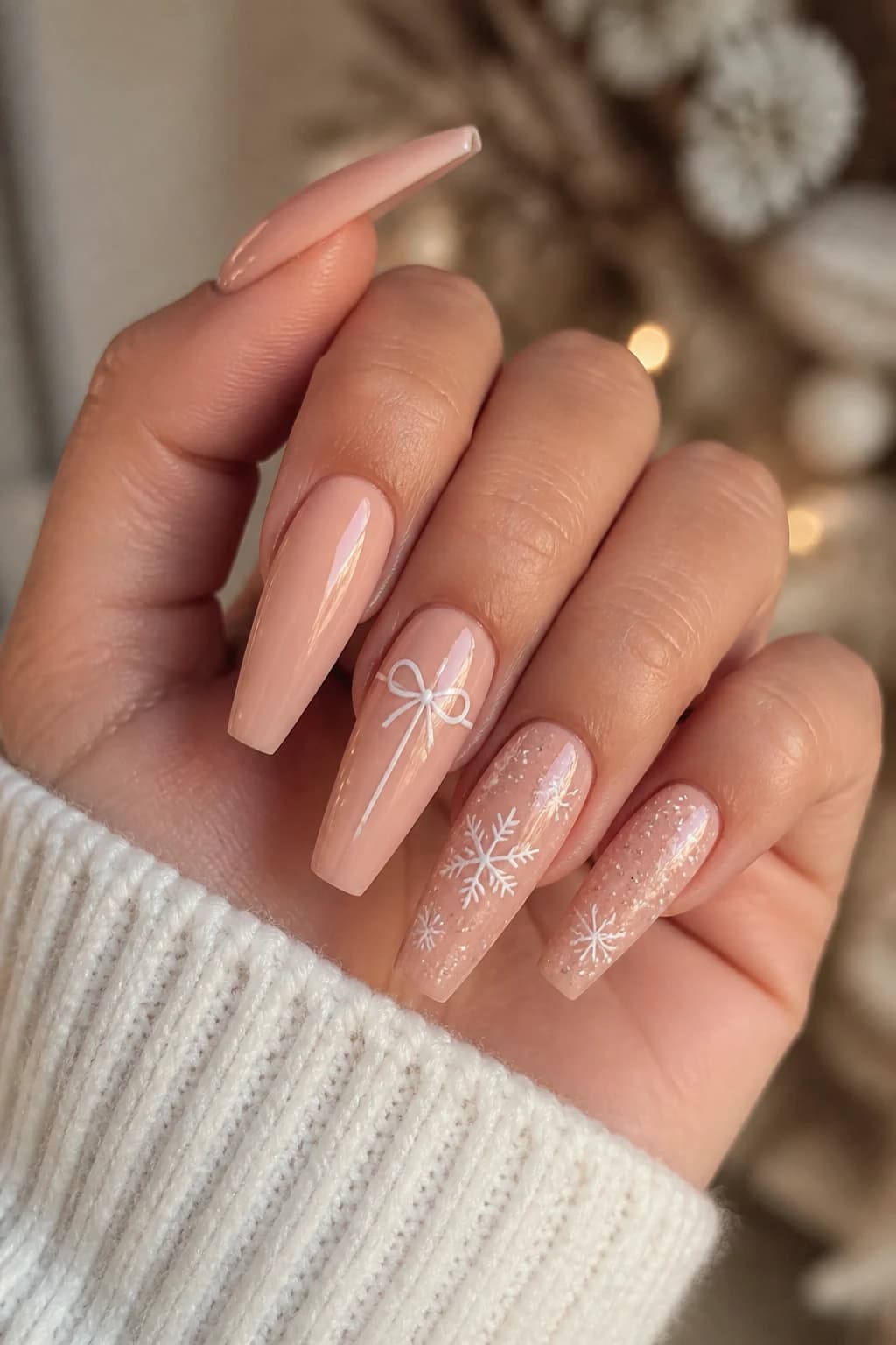 Long coffin nails in nude with a glossy finish, Christmas nail design