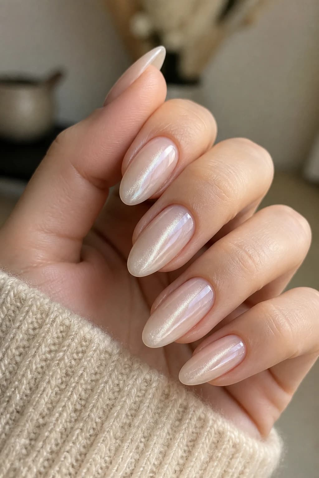 Long almond nails in white and cream with a jelly design and a cat eye finish, fall nail design