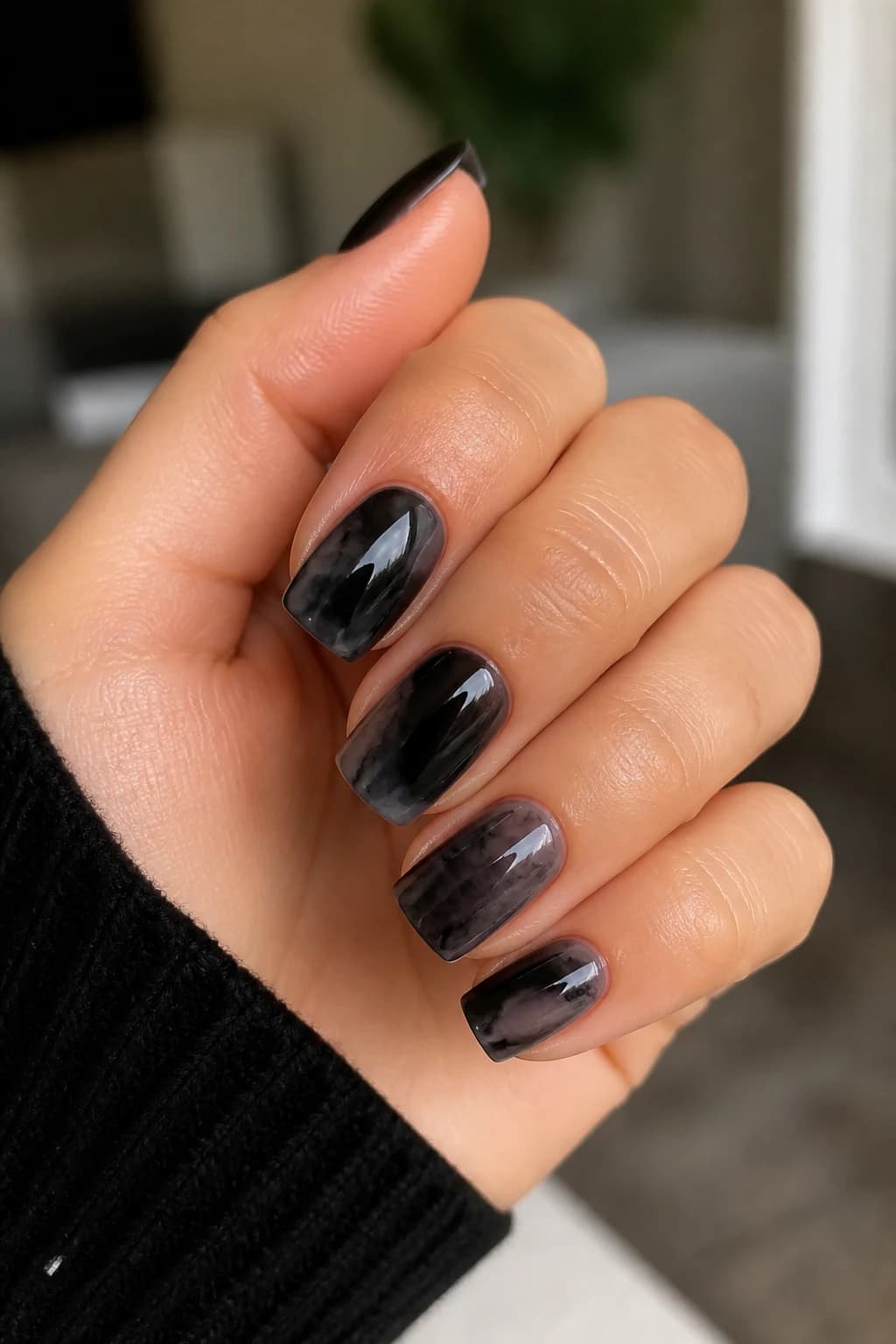 Medium square nails in black with a blooming gel design and a glossy finish, fall nail design