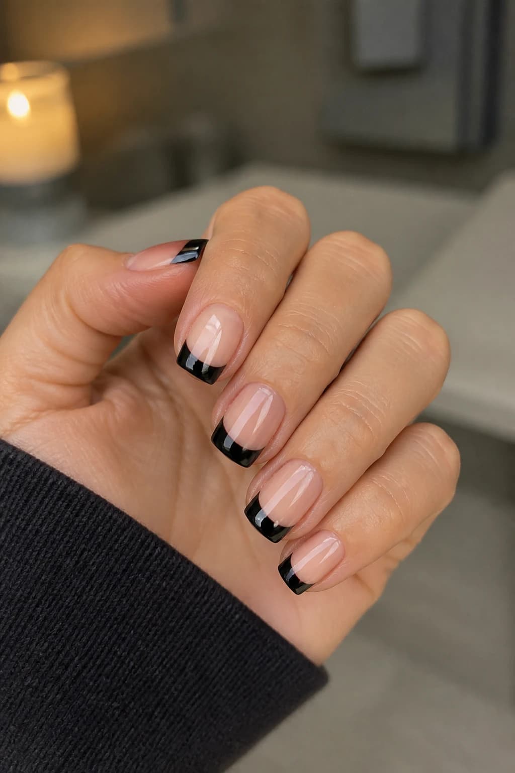 Short coffin nails in black with a French tip design and a glossy finish, fall nail design