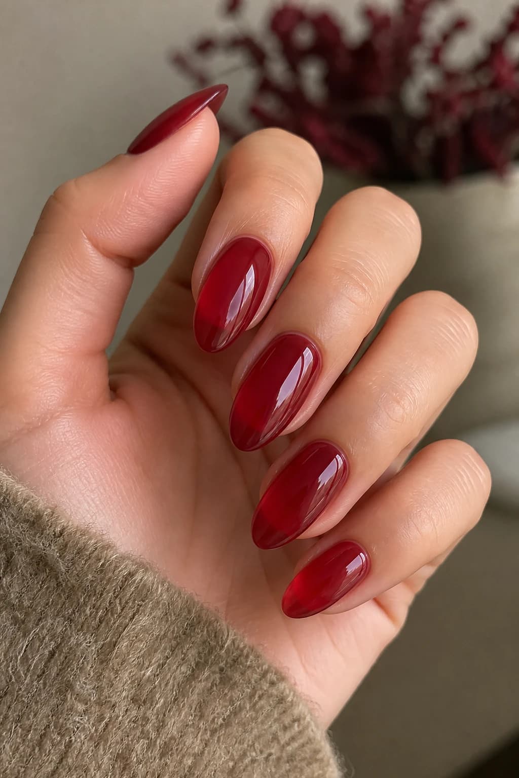Long almond nails in red with a jelly design and a glossy finish, fall nail design