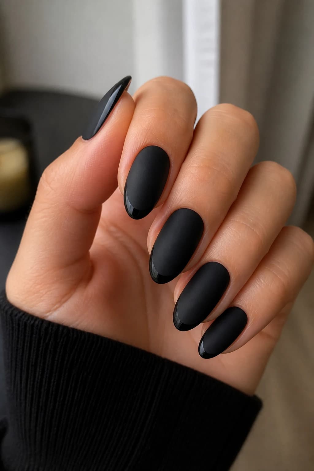 Long almond nails in black with a micro French design and a matte finish, fall nail design